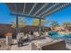 Relaxing backyard oasis with a sparkling pool and pergola at 22633 E Domingo Rd, Queen Creek, AZ 85142