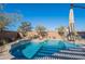 Stunning kidney shaped pool with a pergola at 22633 E Domingo Rd, Queen Creek, AZ 85142