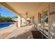 Covered patio overlooks a sparkling pool and spa with ample space for outdoor entertaining at 23204 N Paseo Laredo Ln, Peoria, AZ 85383