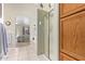 Bathroom with shower stall, tiled floor, and built-in vanity at 23204 N Paseo Laredo Ln, Peoria, AZ 85383