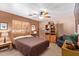 Bedroom with double bed, ceiling fan, and built-in shelving at 23204 N Paseo Laredo Ln, Peoria, AZ 85383
