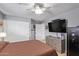 Bedroom with double bed, ceiling fan, and large TV at 23204 N Paseo Laredo Ln, Peoria, AZ 85383