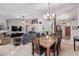 Open concept dining area and living room with fireplace at 23204 N Paseo Laredo Ln, Peoria, AZ 85383
