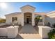 Inviting entryway with arched entry and sitting area at 23204 N Paseo Laredo Ln, Peoria, AZ 85383