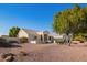 Front view of house showcasing desert landscaping at 23204 N Paseo Laredo Ln, Peoria, AZ 85383