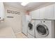 Laundry room with washer, dryer, and refrigerator at 23204 N Paseo Laredo Ln, Peoria, AZ 85383