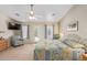 Spacious main bedroom with king bed, patio access and ceiling fan at 23204 N Paseo Laredo Ln, Peoria, AZ 85383