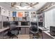 Large office with two workstations and lots of memorabilia at 23204 N Paseo Laredo Ln, Peoria, AZ 85383