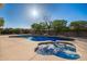 Inviting backyard oasis featuring a sparkling pool and relaxing spa at 23204 N Paseo Laredo Ln, Peoria, AZ 85383