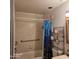 Small bathroom with shower/tub and tiled walls at 2545 W Rose Ln # A-2, Phoenix, AZ 85017