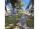 Landscaped courtyard with a shaded walkway and seating area at 2545 W Rose Ln # A-2, Phoenix, AZ 85017