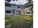 Neatly kept townhouse with a manicured lawn and shaded walkway at 2545 W Rose Ln # A-2, Phoenix, AZ 85017