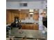 Kitchen with wood cabinets and black appliances at 2545 W Rose Ln # A-2, Phoenix, AZ 85017