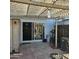 Brick patio with pergola and sliding glass door at 2545 W Rose Ln # A-2, Phoenix, AZ 85017