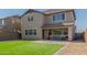 Artificial turf backyard, patio, and home exterior view at 26049 S 230Th St, Queen Creek, AZ 85142