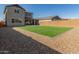 Artificial turf backyard, view of house at 26049 S 230Th St, Queen Creek, AZ 85142