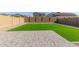 Artificial turf backyard with paved patio area at 26049 S 230Th St, Queen Creek, AZ 85142