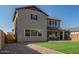 Landscaped backyard with artificial turf and patio at 26049 S 230Th St, Queen Creek, AZ 85142