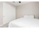 Bedroom with a queen bed and double sliding doors to closet at 26049 S 230Th St, Queen Creek, AZ 85142