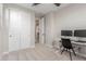 Home office or bedroom with built-in desk and closet at 26049 S 230Th St, Queen Creek, AZ 85142