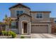 Two-story house with tan exterior, two-car garage, and landscaping at 26049 S 230Th St, Queen Creek, AZ 85142