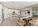 Open concept kitchen with island, white cabinets, and modern appliances at 26049 S 230Th St, Queen Creek, AZ 85142