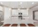 Clean kitchen with white cabinets, quartz countertops, and breakfast bar at 26049 S 230Th St, Queen Creek, AZ 85142