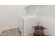 Bright laundry room with washer, dryer, and storage shelves at 26049 S 230Th St, Queen Creek, AZ 85142