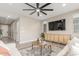 Spacious living room with neutral color palette, large TV, and cozy seating at 26049 S 230Th St, Queen Creek, AZ 85142