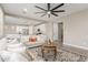 Bright living room with view into kitchen, neutral decor, and comfortable seating at 26049 S 230Th St, Queen Creek, AZ 85142