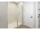 Modern shower with glass enclosure and marble-look walls at 26049 S 230Th St, Queen Creek, AZ 85142