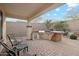 Outdoor kitchen and patio area with built-in grill and seating at 31538 N Larkspur Dr, San Tan Valley, AZ 85143