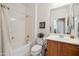 Clean bathroom with shower/tub combo and wood vanity at 31538 N Larkspur Dr, San Tan Valley, AZ 85143