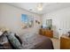 Bright bedroom with a comfortable bed, dresser, and window coverings at 31538 N Larkspur Dr, San Tan Valley, AZ 85143