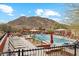 Relaxing pool area with lounge chairs and mountain views at 31538 N Larkspur Dr, San Tan Valley, AZ 85143