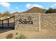 Community entrance with stone wall and Solera signage at 31538 N Larkspur Dr, San Tan Valley, AZ 85143