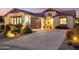 Two-car garage and well-maintained landscaping at 31538 N Larkspur Dr, San Tan Valley, AZ 85143