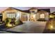 Two-story home with desert landscaping and a two car garage at 31538 N Larkspur Dr, San Tan Valley, AZ 85143