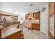 Well-lit kitchen with wood cabinets and a large island at 31538 N Larkspur Dr, San Tan Valley, AZ 85143