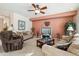 Spacious living room with neutral colored furniture and a large TV at 31538 N Larkspur Dr, San Tan Valley, AZ 85143