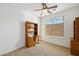 Home office with built-in shelving and window at 31538 N Larkspur Dr, San Tan Valley, AZ 85143