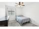Small bedroom with a window and ceiling fan at 3376 S 256Th Dr, Buckeye, AZ 85326