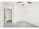 Bedroom with double doors leading to a small hallway at 3376 S 256Th Dr, Buckeye, AZ 85326
