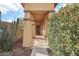 Covered entryway with a security door and desert landscaping at 3376 S 256Th Dr, Buckeye, AZ 85326