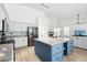 Open kitchen features a large island and stainless steel appliances at 3376 S 256Th Dr, Buckeye, AZ 85326