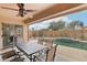 Patio with pool view and outdoor dining table at 3376 S 256Th Dr, Buckeye, AZ 85326