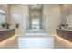 Luxury bathroom featuring freestanding tub, dual vanities, and modern design, creating a spa-like retreat at 35065 N 83Rd Pl # 4, Scottsdale, AZ 85266