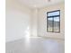 Bright bedroom featuring a large window, neutral paint, and tile floors at 35065 N 83Rd Pl # 4, Scottsdale, AZ 85266