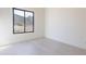 Clean bedroom with a large window overlooking the exterior at 35065 N 83Rd Pl # 4, Scottsdale, AZ 85266