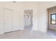 Neutral bedroom featuring a large closet and tile floors at 35065 N 83Rd Pl # 4, Scottsdale, AZ 85266